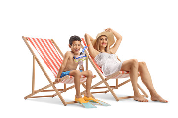 Boy and mother on a summer vacation, sunbathing on loungers