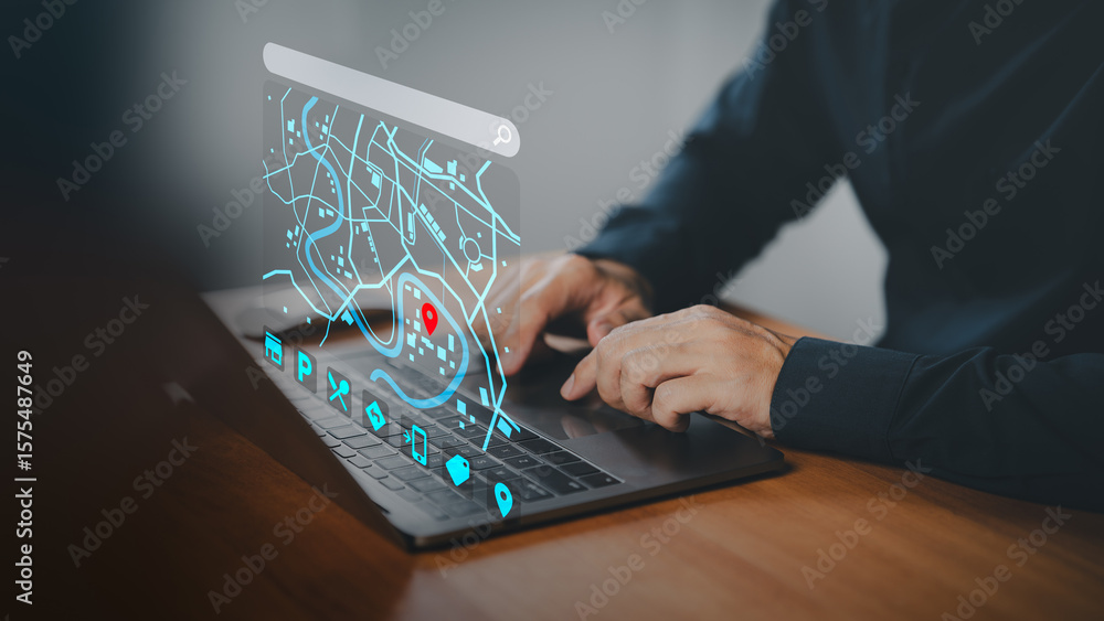 Fototapete hands typing on a laptop keyboard with a futuristic digital map interface showing a red location pin