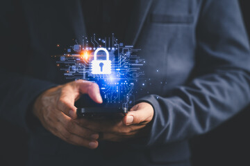 Close-up of a person holding a smartphone with a glowing digital padlock icon, symbolizing mobile...