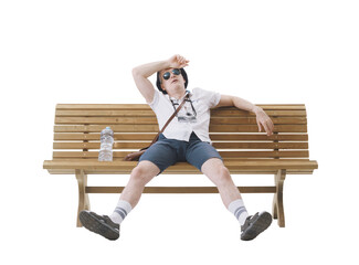 Middle-aged male tourist sitting on a bench, suffering from the heat. Concept of climate change.