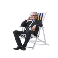 Manager in a black suit talking on the phone while sitting on a beach chair, isolated on a neutral...