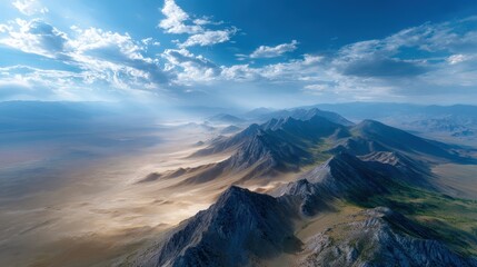 Aerial View of a Desert Mountain Range Under a Bright Sunny Sky