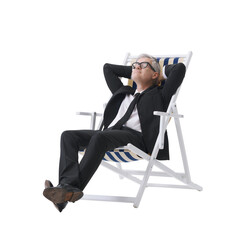 Manager in a black suit relaxing while sitting on a beach chair, isolated on a neutral background.