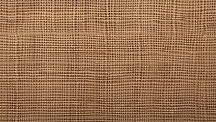 Close up of a coarse woven natural brown burlap fabric texture with a visible grid pattern and rough fibers