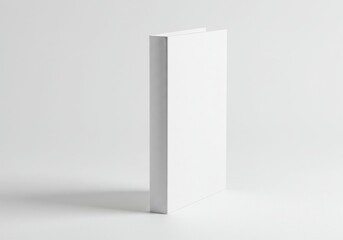 A blank white hardcover book stands isolated on a white background