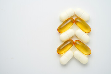 Clock made of pills capsules, pills form a circle, omega, vitamins, Cod liver oil, supplements