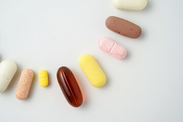 Clock made of pills capsules, pills form a circle, omega, vitamins, Cod liver oil, supplements
