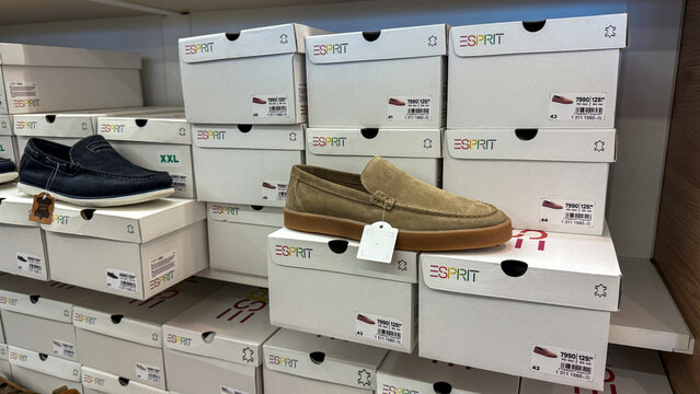 Elegant Esprit loafers rest on a cascade of Esprit boxes, ideal for International Shoe Day and Imelda Marcos' Birthday June 5, 2025, Belgrade, Serbia