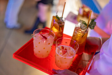 Colorful Cocktails Served on Bright Red Tray at Party