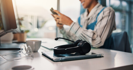 Break, call center and support with headset on desk in office for communication, contact us or...