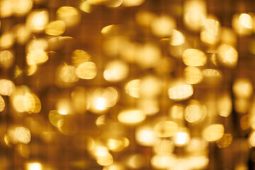 cream background with elegant gold bokeh particles