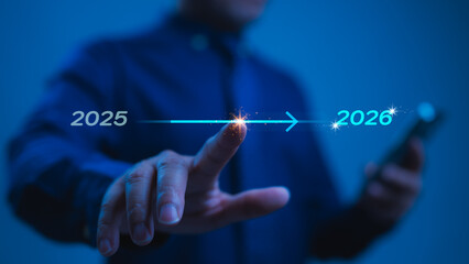 Futuristic Hand Reaching For Glowing Arrow Digital Advancement From 2025 To 2026, Persons Touch Ignites Light Expansion, Device In Hand, Marking A New Years Technological Leap