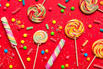 Tasty appetizing Party Accessories Happy Birthday Sweet. Different types of candies on colored...