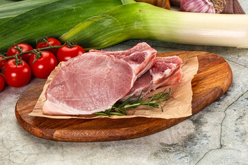 Raw pork steak loin with bone