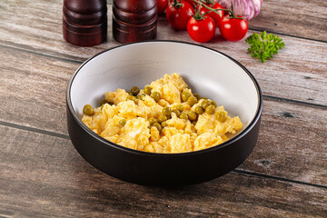 Scrambled egg omelet with green peas