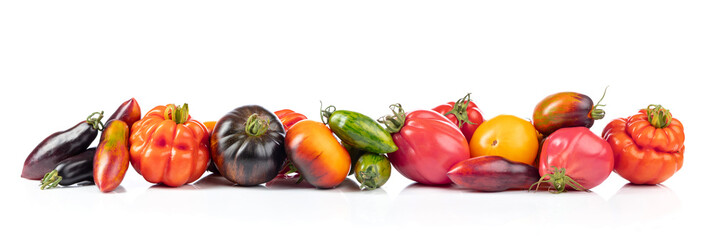 Different tomatoes isolated on white background.