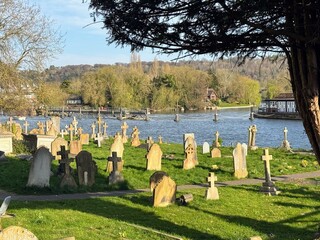 25 April 2025 - Marlow, Bucks, UK: View of cemetery with River Thames beyond