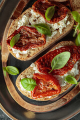 Ciabatta with sun dried tomatoes in olive oil, ricotta and basil.