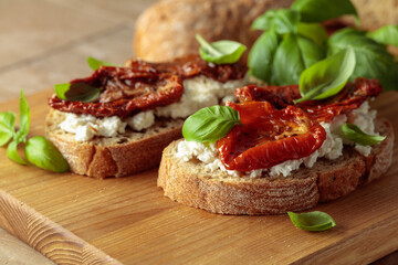 Ciabatta with sun dried tomatoes in olive oil, ricotta, and basil.