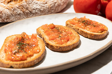 Tomato toast traditional mediterranean breakfast on kitchen countertop close up