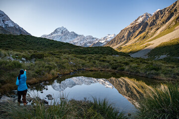 Hooker valley scenery with unrecognisable hiker in Aoraki Mt Cook National Park