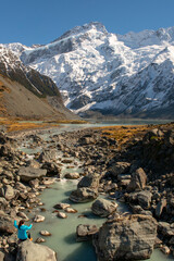 Hooker valley scenery with unrecognisable hiker in Aoraki Mt Cook National Park