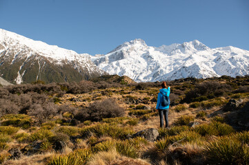 Hooker valley scenery with unrecognisable hiker in Aoraki Mt Cook National Park