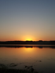 sunset over lake in summer