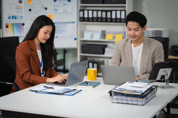 Business team doing paperwork. Focused business team learning financial graphs, working on corporate project at briefing meeting.