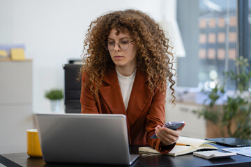 Businesswoman analyzing financial graphs, calculating company expenses, and planning investments,...