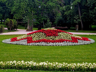 ornamental flower bed in front of the castle on the ground floor. Planting annuals has the shape of...