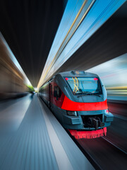 Fototapeta premium Modern train in motion and blur, Armenian Railways trains of Yerevan. Cyberpunk train. Blur motion train. Train travel, movement, for banner, for advertising. High quality photo