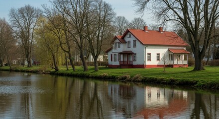Fototapeta premium Tranquil canalside house reflection