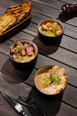 Rustic risotto bowls with chicken, beef, and shrimp, served with toasted bread and herbs — a cozy, hearty, and flavorful dining experience.
