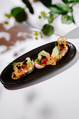 Unique gourmet dish with delicate ingredients on an elegant plate