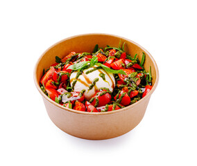 Fresh burrata salad with cherry tomatoes, arugula, and pesto dressing served in a paper bowl. A light, colorful, and flavorful Mediterranean dish.
