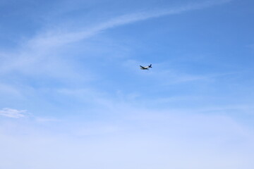Small airplane in the sky over sea