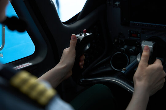 Pilot student operating aircraft controls during flight training