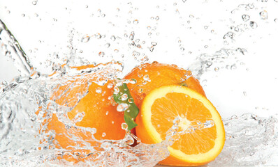 Oranges splashing in clear water citrus fruit