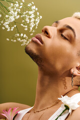 Young charismatic man embracing nature and style in a vibrant studio setting