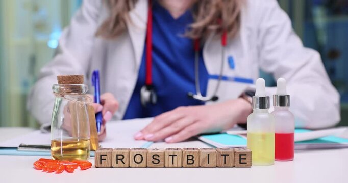 A healthcare professional evaluates frostbite treatment options using various lab supplies and materials