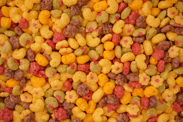 Sweet crunchy cornflakes as a background. Top view.