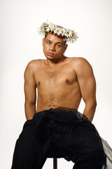 Striking pose of a young african american man in a creative studio setup
