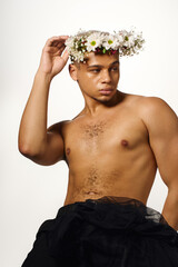 Self-expression and beauty in a studio with a young man showcasing his style