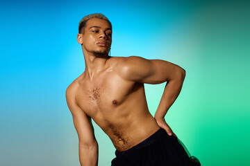 Young shirtless African American man with dyed hair showcasing confidence in the studio