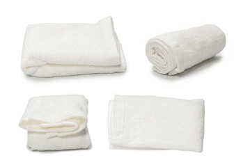 White fluffy cotton towel isolated on a white background.