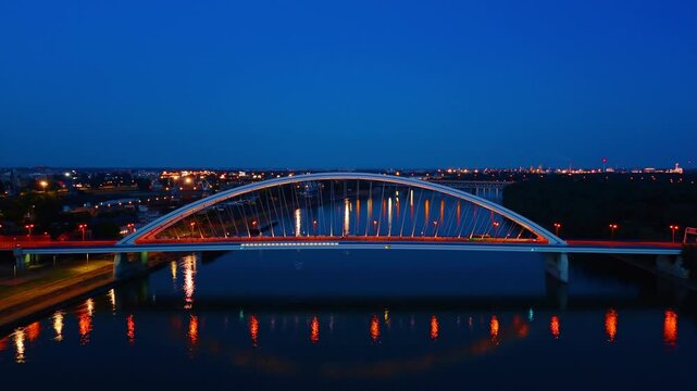 Appolo Bridge over the Danube in Bratislava, Slovakia. City lights are switched on at night time.