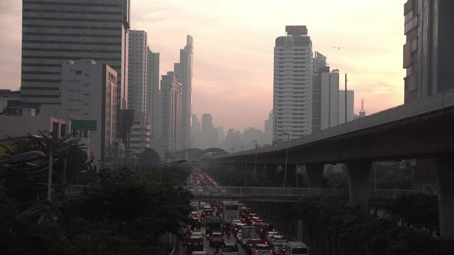 Cityscape of Bangkok covered by mixture of dust in air pollution. Heavy air pollution of fine particulate matter (PM2.5) in morning.	