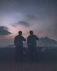 Silhouette of people on Deomali hill top at night in Koraput, Odisha, India in November 2024....