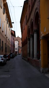 Walking through the narrow streets of Bologna, with historic arcades, pastel-colored buildings, and the timeless charm of Emilia-Romagna&rsquo;s capital